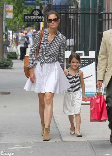 Suri Cruise matched her mom, Katie Holmes, in a white skirt, striped tank, and metallic flats as they walked around NYC in June.
Suri Cruise matched her mom, Katie Holmes, in a white skirt, striped tank, and metallic flats as they walked around NYC in June.
