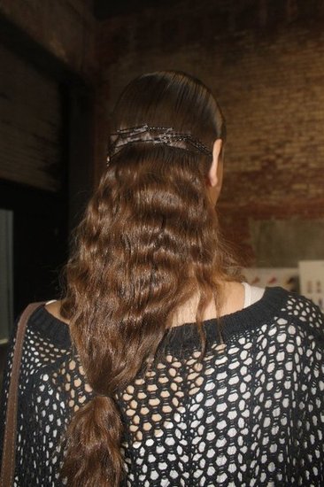 The completed hair look calls to mind an upside-down birdcage.
The completed hair look calls to mind an upside-down birdcage.
