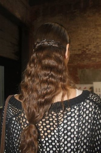 The completed hair look calls to mind an upside-down birdcage.
The completed hair look calls to mind an upside-down birdcage.