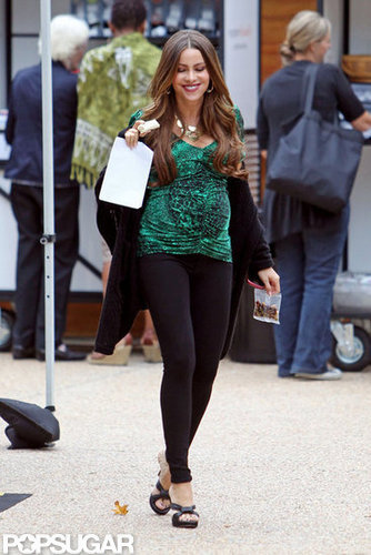 Sofia Vergara wore black leggings and a green top on set.
Sofia Vergara wore black leggings and a green top on set.
