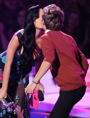 Katy Perry greeted One Direction on stage.
Katy Perry greeted One Direction on stage.
