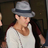 Marion Cotillard's Eclectic Travel Style: Fedora + Red Studded Boots Marion Cotillard's Eclectic Travel Style: Fedora + Red Studded Boots