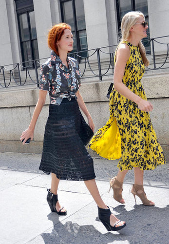 Taylor Tomasi Hill (left) proved her style versatility once again, slipping into a tropical-print button-down, textured midi skirt, and cutout wedges. Her equally stylish companion made the rounds in a printed dress and lace-up heels.
Taylor Tomasi Hill (left) proved her style versatility once again, slipping into a tropical-print button-down, textured midi skirt, and cutout wedges. Her equally stylish companion made the rounds in a printed dress and lace-up heels.
