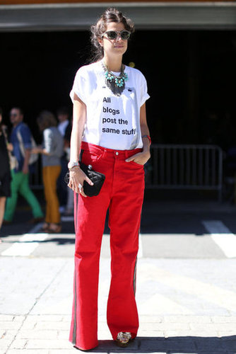 Leandra Medine outfitted a pair of red jeans with a statement tee.
Leandra Medine outfitted a pair of red jeans with a statement tee.