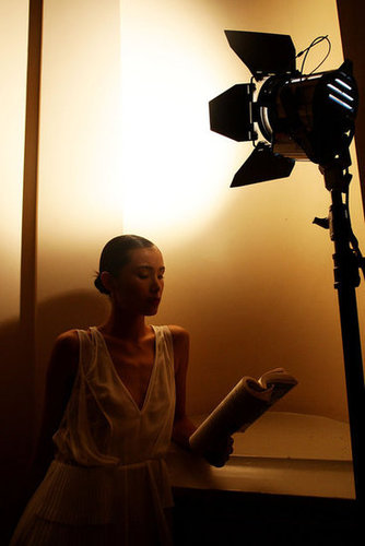 During Australia's Fashion Week last Fall, a model used backstage light to dig into her book.
During Australia's Fashion Week last Fall, a model used backstage light to dig into her book.