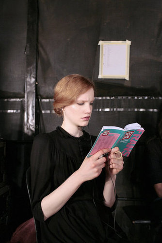 A model read a book backstage ahead of a 2007 fashion show in Paris.
A model read a book backstage ahead of a 2007 fashion show in Paris.