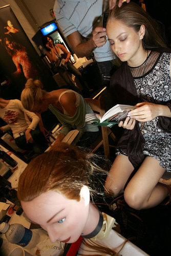 A model used her hair time to catch up on her reading backstage at the Willow Spring 2006 fashion show during Olympus Fashion Week.
A model used her hair time to catch up on her reading backstage at the Willow Spring 2006 fashion show during Olympus Fashion Week.