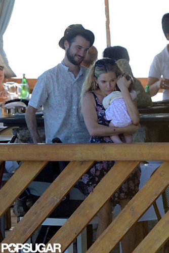Tom Sturridge smiled as he watched Sienna Miller cuddle baby Marlowe.
Tom Sturridge smiled as he watched Sienna Miller cuddle baby Marlowe.