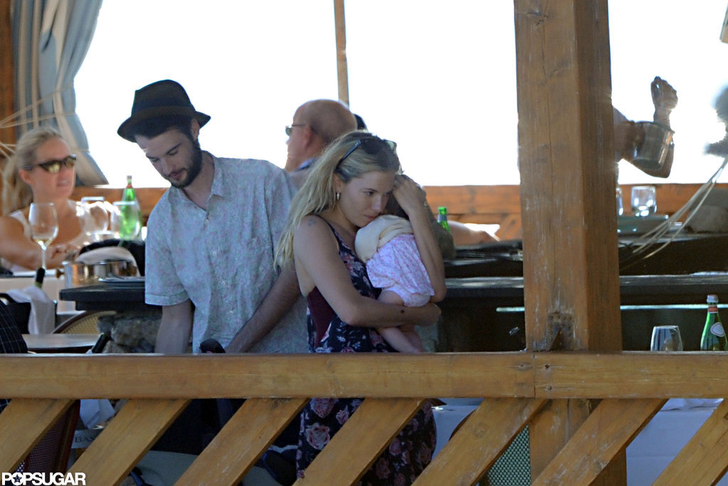 Tom Sturridge watched Sienna Miller hold baby Marlowe.
Tom Sturridge watched Sienna Miller hold baby Marlowe.
