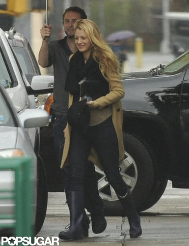 Blake Lively had help with her umbrella.
Blake Lively had help with her umbrella.