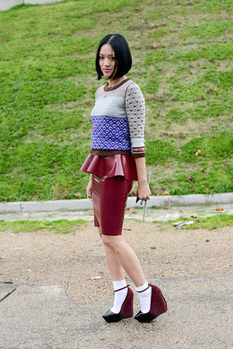 Latex peplum and socks with her Theyskens platforms gave this look irreverent charm.
Latex peplum and socks with her Theyskens platforms gave this look irreverent charm.