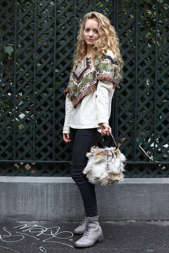 This one is all about the accessories — a fringed capelet and a fur satchel lend quirky luxe.
This one is all about the accessories — a fringed capelet and a fur satchel lend quirky luxe.