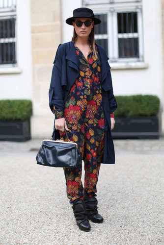 This styler smartly subdued her floral jumpsuit with a fedora and a navy trench.
This styler smartly subdued her floral jumpsuit with a fedora and a navy trench.