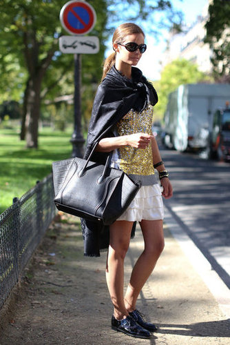 A glittery top plays well with a ruffled skirt, while a Céline tote and brogues do their part to ground the look.
A glittery top plays well with a ruffled skirt, while a Céline tote and brogues do their part to ground the look.
