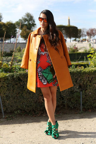 Shades of orange, right down to the lenses on her mirrored sunglasses, kept this bold style color-coordinated.
Shades of orange, right down to the lenses on her mirrored sunglasses, kept this bold style color-coordinated.