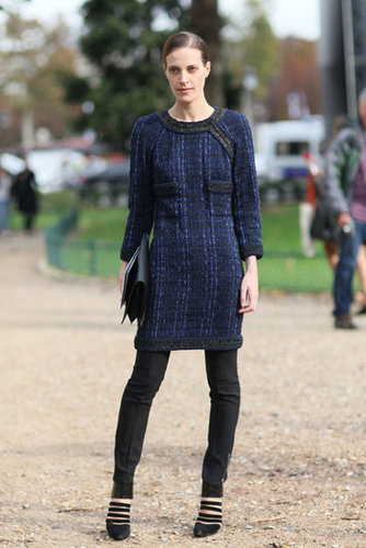 A tweedy midnight blue dress right over slim black pants made this a chic snap.
A tweedy midnight blue dress right over slim black pants made this a chic snap.