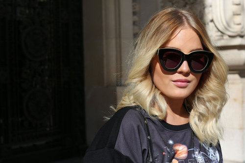 Her shirt may say space age, but her sunglasses say classic glamazon.
Her shirt may say space age, but her sunglasses say classic glamazon.