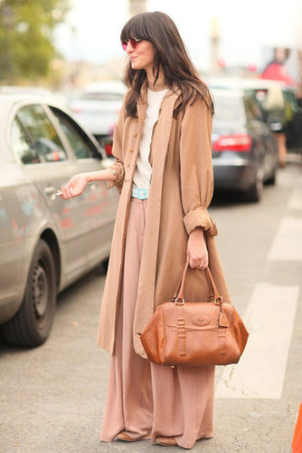 Neutral layers may be understated, but her rose-colored glasses certainly are not.
Neutral layers may be understated, but her rose-colored glasses certainly are not.