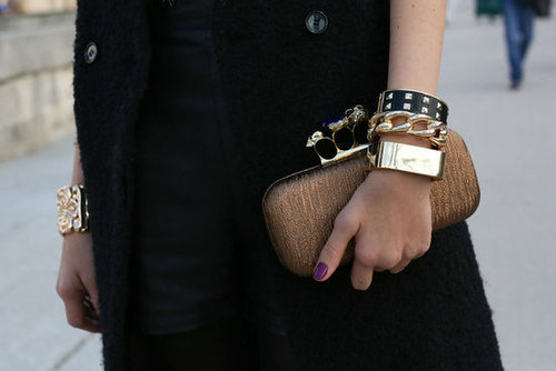 A well-stacked wrist and an Alexander McQueen clutch popped against a classic coat.
A well-stacked wrist and an Alexander McQueen clutch popped against a classic coat.