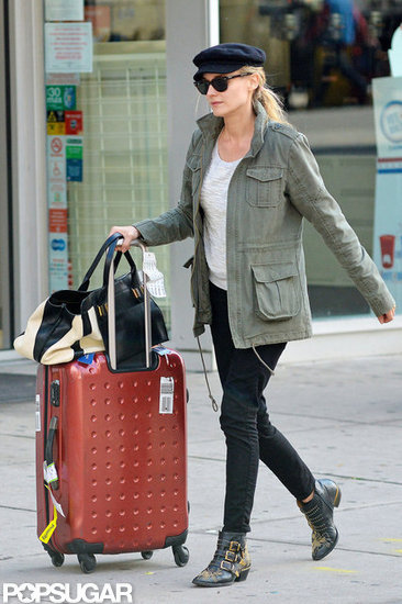 Diane Kruger wore a green jacket to wheel her suitcase out of her hotel in NYC. Diane Kruger wore a green jacket to wheel her suitcase out of her hotel in NYC.