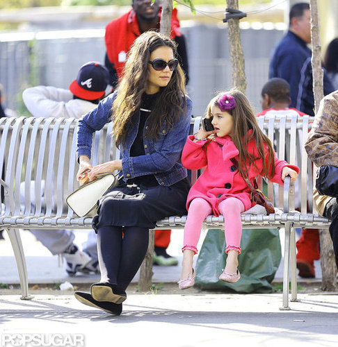 Suri Cruise talked on the phone while out with Katie Holmes in NYC.
Suri Cruise talked on the phone while out with Katie Holmes in NYC.