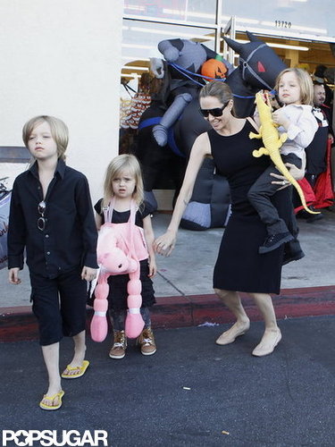Angelina Jolie carried Knox on her hip as she made her way out of a Halloween store in LA with Vivienne and Shiloh in October.
Angelina Jolie carried Knox on her hip as she made her way out of a Halloween store in LA with Vivienne and Shiloh in October.