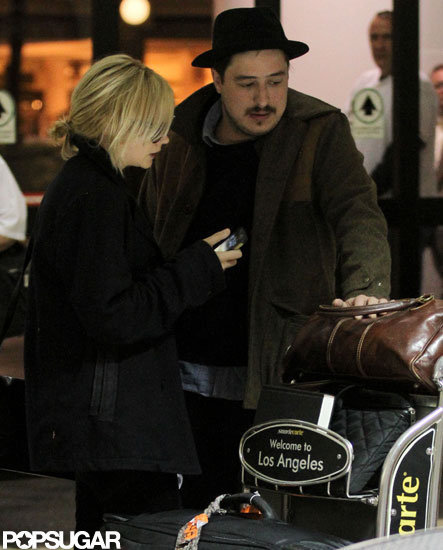 Carey Mulligan and husband Marcus Mumford arrived at LAX.
Carey Mulligan and husband Marcus Mumford arrived at LAX.