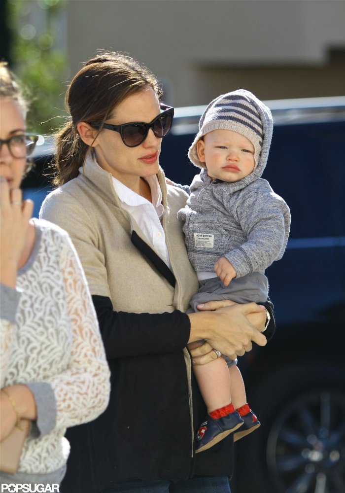 Samuel Affleck hitched a ride on his mom's hip. Samuel Affleck hitched a ride on his mom's hip.