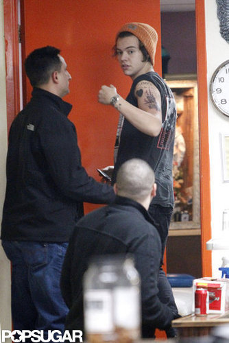 Harry Styles showed off his new tattoo of a large ship.
Harry Styles showed off his new tattoo of a large ship.