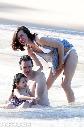 Bikini-Clad Milla Jovovich Poses Beachside With Her Family on NYE Bikini-Clad Milla Jovovich Poses Beachside With Her Family on NYE