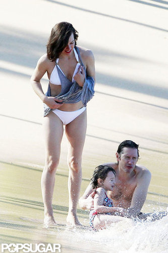 Bikini-Clad Milla Jovovich Poses Beachside With Her Family on NYE Bikini-Clad Milla Jovovich Poses Beachside With Her Family on NYE