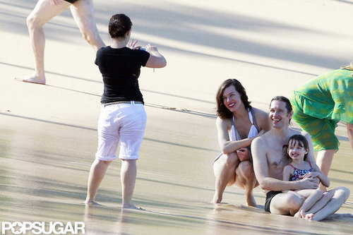 Bikini-Clad Milla Jovovich Poses Beachside With Her Family on NYE Bikini-Clad Milla Jovovich Poses Beachside With Her Family on NYE
