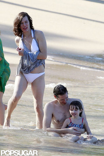 Bikini-Clad Milla Jovovich Poses Beachside With Her Family on NYE Bikini-Clad Milla Jovovich Poses Beachside With Her Family on NYE