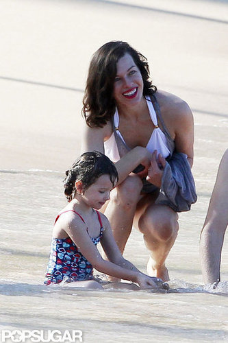 Bikini-Clad Milla Jovovich Poses Beachside With Her Family on NYE Bikini-Clad Milla Jovovich Poses Beachside With Her Family on NYE