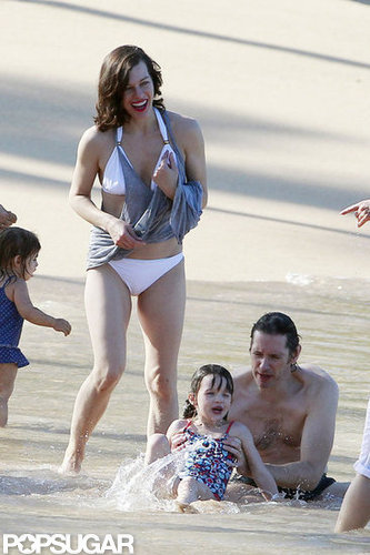 Bikini-Clad Milla Jovovich Poses Beachside With Her Family on NYE Bikini-Clad Milla Jovovich Poses Beachside With Her Family on NYE