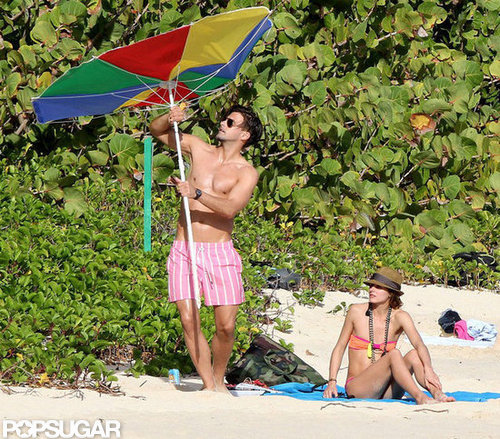 Olivia Palermo and boyfriend Johannes Huebl tried to fix their broken beach umbrella.
Olivia Palermo and boyfriend Johannes Huebl tried to fix their broken beach umbrella.
