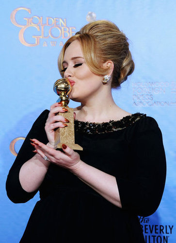 Adele kissed her Globe in the press room after winning best original song in a motion picture for Skyfall.
Adele kissed her Globe in the press room after winning best original song in a motion picture for Skyfall.