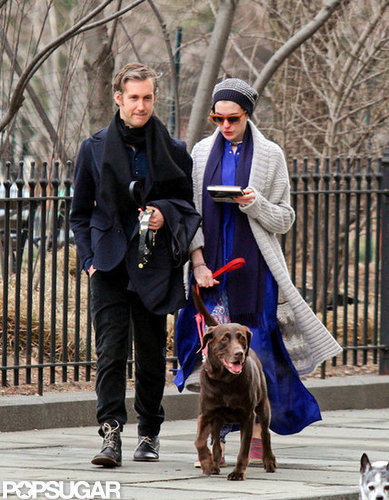 Anne Hathaway read while she and Adam Shulman walked the dog.
Anne Hathaway read while she and Adam Shulman walked the dog.