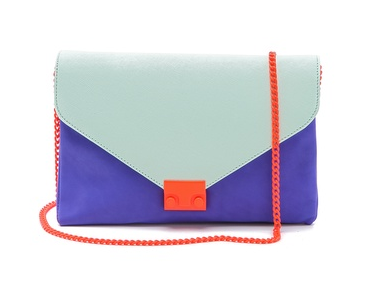 Loeffler Randall's colorblocked clutch ($295) would shine in the night. The colors are great together, and the orange chain strap is too cool for words.
Loeffler Randall's colorblocked clutch ($295) would shine in the night. The colors are great together, and the orange chain strap is too cool for words.