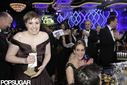 Lena Dunham smiled big after picking up her Golden Globe statue for Girls.
Lena Dunham smiled big after picking up her Golden Globe statue for Girls.