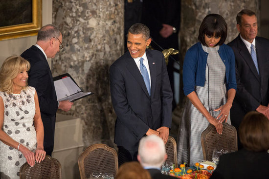 The Obamas headed into the inaugural lunch, where Michelle stuck with a Thom Browne printed dress and added a cropped blue Reed Krakoff cardigan.
The Obamas headed into the inaugural lunch, where Michelle stuck with a Thom Browne printed dress and added a cropped blue Reed Krakoff cardigan.