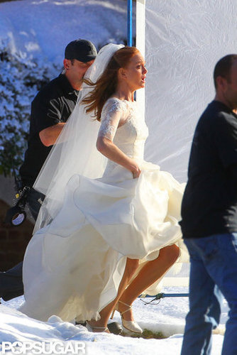 Jayma ran out of a building in a wedding dress.
Jayma ran out of a building in a wedding dress.