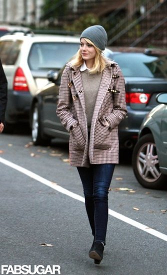 Emma Stone's plaid buckle coat, gray beanie, and signature sweater-cum-blouse duo were equal parts toasty and trendy.
Emma Stone's plaid buckle coat, gray beanie, and signature sweater-cum-blouse duo were equal parts toasty and trendy.