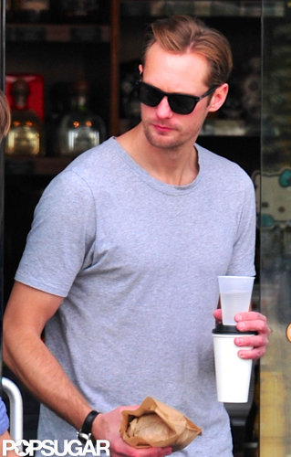 Alexander Skarsgard carried two drinks.
Alexander Skarsgard carried two drinks.