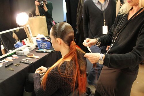 "The ponytail is simple and dramatic," Guido said. "There's no reference to any period, but it is slightly futuristic." The swatch of whiskey-tinted hair added to the surrealism of the look.
"The ponytail is simple and dramatic," Guido said. "There's no reference to any period, but it is slightly futuristic." The swatch of whiskey-tinted hair added to the surrealism of the look.