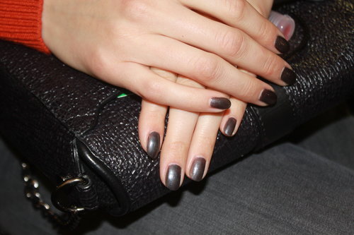 Michelle Saunders, the lead manicurist for Essie, applied one coat of Over the Top on hands to get an icy gray finish. This particular color was selected because it complemented the embellishments on the clothing. On toes, Stylonomics (a hunter green shade) was applied to match the footwear on the catwalk. Just before the models hit the runway, Saunders dabbed on a bit of cuticle oil for added shine and moisture.
Michelle Saunders, the lead manicurist for Essie, applied one coat of Over the Top on hands to get an icy gray finish. This particular color was selected because it complemented the embellishments on the clothing. On toes, Stylonomics (a hunter green shade) was applied to match the footwear on the catwalk. Just before the models hit the runway, Saunders dabbed on a bit of cuticle oil for added shine and moisture.