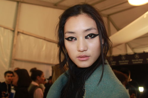 If you aren't quite bold enough to try this look on a Saturday night, draw a similar shape with black liner, making it shorter and thinner. Garland recommends smudging the shape and adding mascara for a similar look that's more wearable for the average woman.
If you aren't quite bold enough to try this look on a Saturday night, draw a similar shape with black liner, making it shorter and thinner. Garland recommends smudging the shape and adding mascara for a similar look that's more wearable for the average woman.