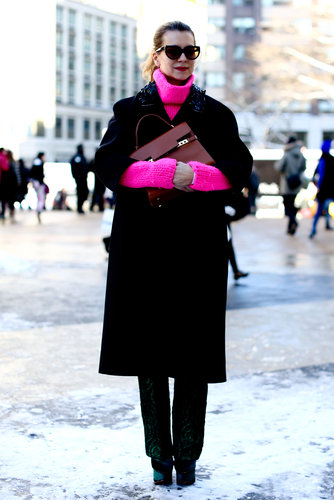 Natalie Joos added a jolt of high-wattage hot pink to black outerwear.
Natalie Joos added a jolt of high-wattage hot pink to black outerwear.