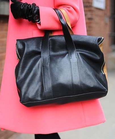 Phillip Lim's 31 hour bag stands out against a bold pink coat.
Phillip Lim's 31 hour bag stands out against a bold pink coat.