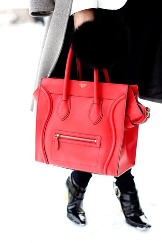 Céline's iconic luggage tote dipped in a bright red hue.
Céline's iconic luggage tote dipped in a bright red hue.